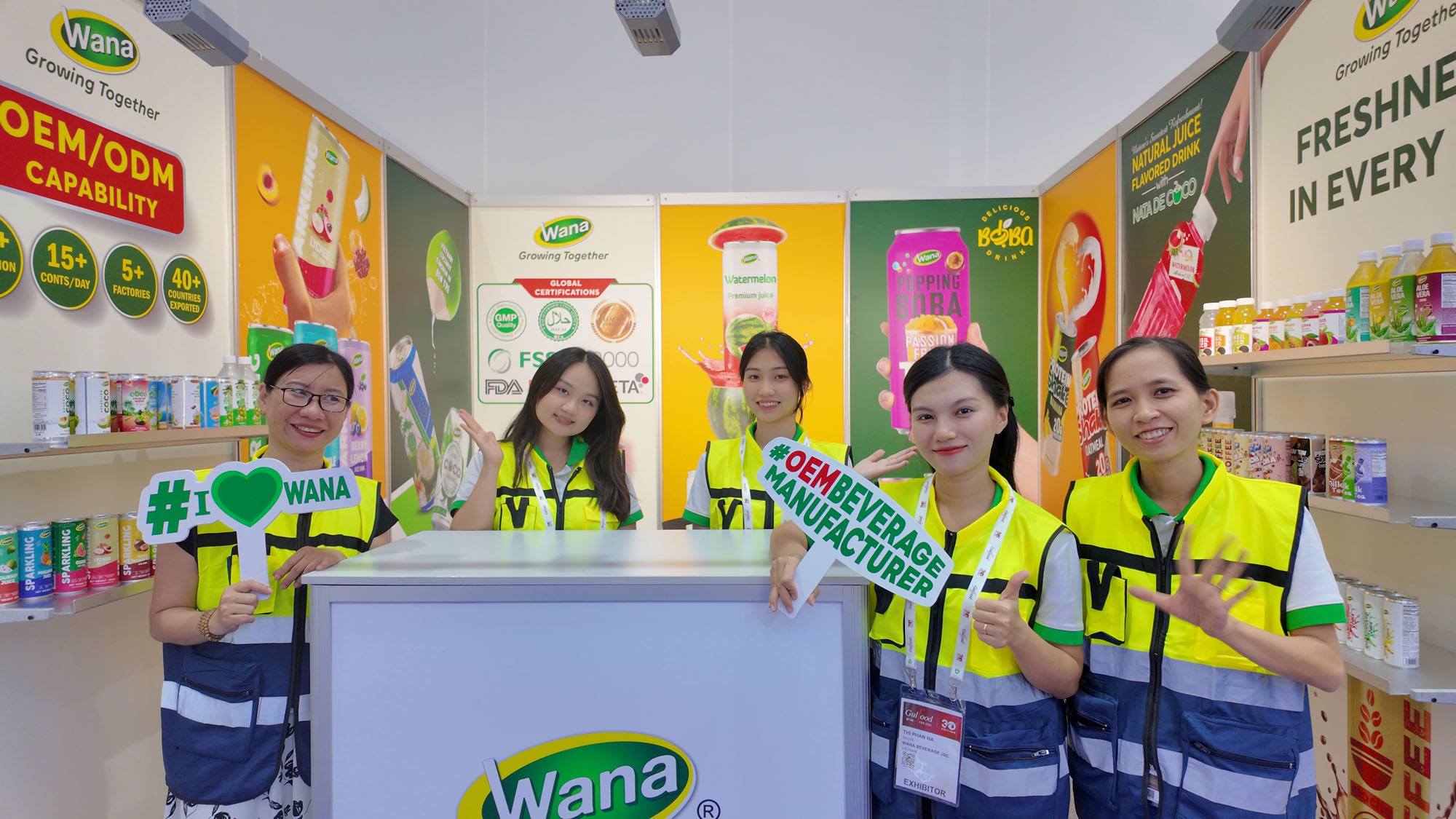 Wana Beverage team at exhibition booth showcasing OEM and ODM beverage manufacturing solutions